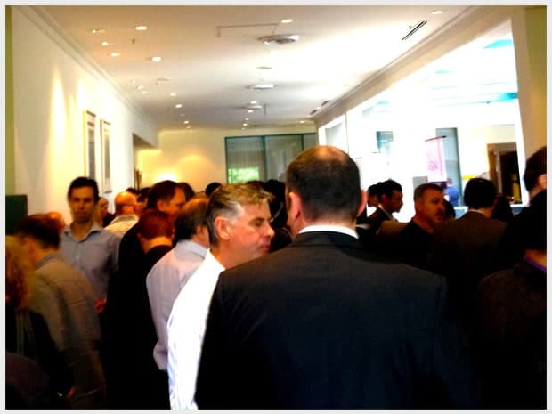 Visitors talking with Reach Digital staff at the digital services expo stand