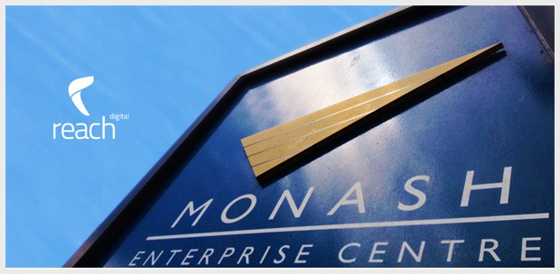 Monash Enterprise Centre signage photographed with the Reach Digital logo overlay